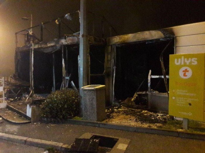a burned-out Vinci office at a motorway tollbooth